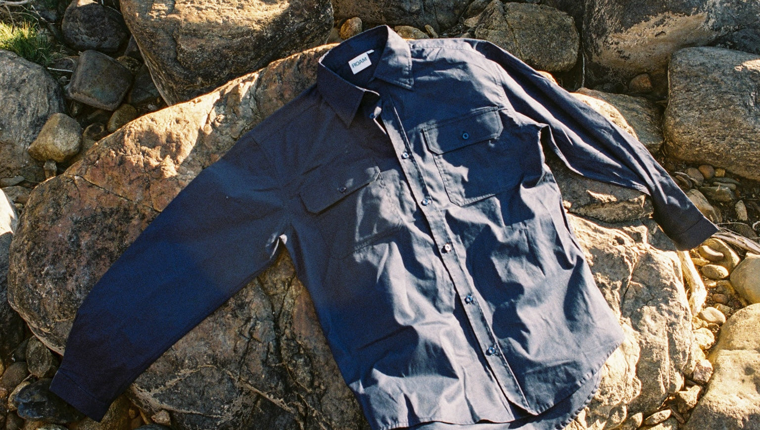 Dark blue jacket on a rocky surface